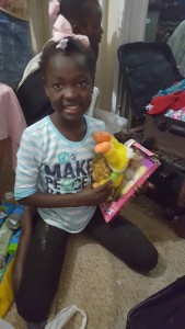mission trip march 2017 girls open boxes 3